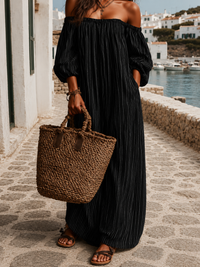 Robe longue ample à épaules dénudées, noire à rayures verticales, manches bouffantes