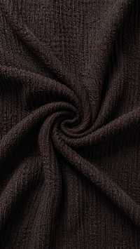 Tissu côtelé sombre de combinaison, maille torsadée et effet plissé au niveau de la couture