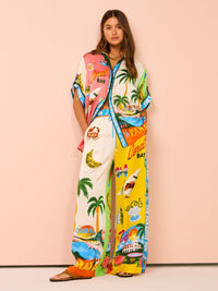 Ensemble de plage à imprimé tropical : pantalon ample multicolore et haut blanc sans manches