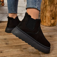 Bottes douillettes noires avec bord fourré, élastique latéral et semelle massive