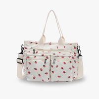 Sac cabas blanc à motifs fraises, poches zippées et anses doubles