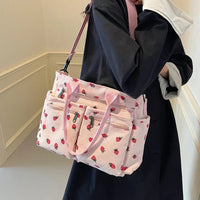 Sac cabas rose à motifs fraises, bandoulière réglable et poches multiples