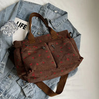 Sac cabas marron à mini motif, poches zippées multiples et anses en tissu
