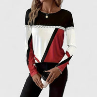 Pull colorblock graphique rouge, blanc et noir, encolure ronde, manches longues.