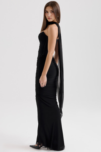Robe midi noire style corset en maille, vue de profil, fente latérale.