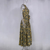 Robe longue d’été sans manches jaune et noire à motif floral, taille ceinturée.