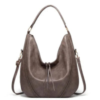 Sac à bandoulière classique en cuir gris foncé, anses courtes et franges