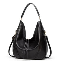 Sac à bandoulière classique en cuir noir, coutures et franges pendantes