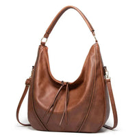 Sac à bandoulière classique en cuir marron, perforations décoratives sur le côté