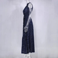 Robe longue Zaria bleu nuit à pois blancs, sans manches, jupe ample, encolure haute.