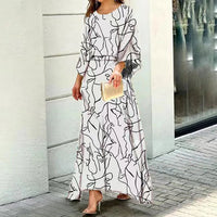 Robe longue ample blanche à motifs noirs, manches 3/4, coupe fluide