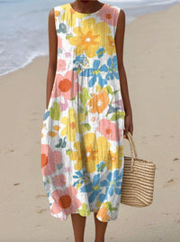 Robe d'été sans manches, imprimé fleurs abstraites pastel sur fond blanc, coupe ample.