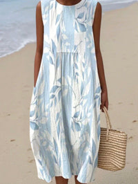 Robe d'été sans manches, imprimé bleu clair sur fond blanc, coupe ample.
