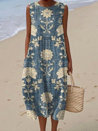 Robe d'été sans manches bleue, imprimé fleurs beige, coupe ample.