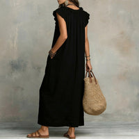 Robe longue noire en lin texturé, dos avec plis et volant, ourlet droit