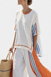 Pantalon blanc à rayures orange et bleues, coupe ample et confortable