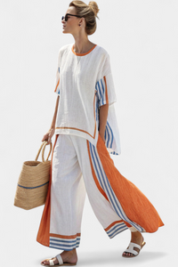 Pantalon blanc ample en tissu léger, bordures rayées orange et bleues