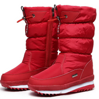 Bottes de neige imperméables rouges, tige matelassée, fermeture zippée, semelle profilée