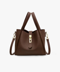 Sac à main en cuir texturé brun, poignées hautes et bandoulière, fermeture centrale