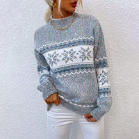 Pull vintage en maille bleu chiné, motifs jacquard et bordures à rayures