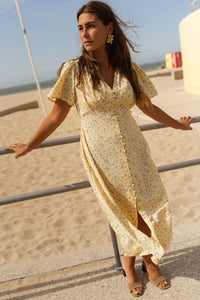 Robe midi jaune à imprimé floral, encolure V, manches courtes, coupe évasée