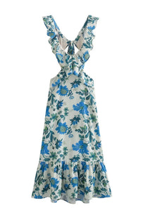 Robe longue à volants florale bleue, décolleté en V, bretelles nouées, ourlet volanté.