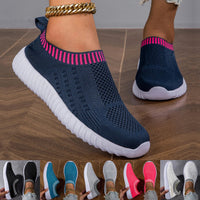 Baskets orthopédiques bleu marine en maille, semelle blanche, col et bord rose vif