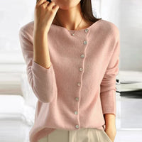 Cardigan rose à boutons, encolure en V, manches longues, maille douce.