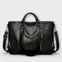 Grand sac en cuir noir avec anses, bandoulières réglables et fermeture zippée centrale
