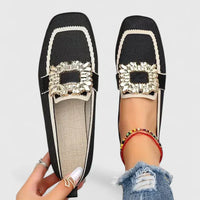 Mocassins orthopédiques noirs, bordure blanche, boucle décorative dorée