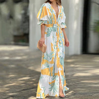 Robe longue à col V, imprimé floral orange et vert sur fond blanc, ceinture, manches bouffantes