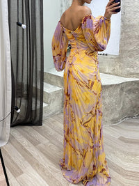 Robe longue imprimée jaune et violet, corsage froncé, manches bouffantes, vue dos