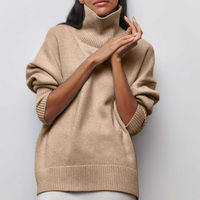 Pull à col roulé en maille beige, manches longues bouffantes, point côtelé