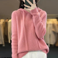Pull en laine mérinos rose à capuche avec cordons, coupe ample et manches longues