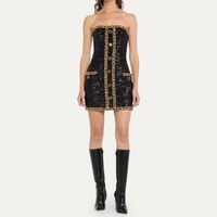 Robe bustier noire à sequins, liseré doré et fermeture centrale, coupe courte