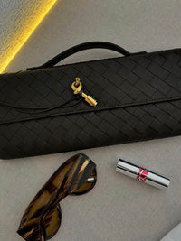 Sac tressé noir au motif en tresses, fermoir doré