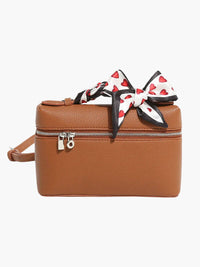 Sac à main compact marron avec nœud rayé rouge et blanc, fermeture éclair
