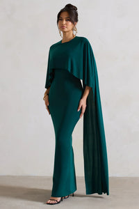 Robe longue vert foncé à manches cape, jupe fourreau et drapé sur le buste
