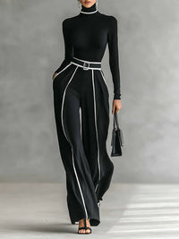 Ensemble noir col roulé manches longues + pantalon large à bandes verticales blanches