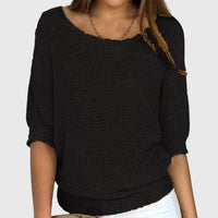 Pull ample en maille douce noir, col rond, manches trois-quarts bouffantes, bords côtelés