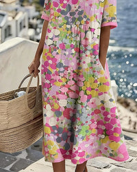 Robe midi ample fleurie rose, détails à plis, manches courtes, encolure ronde
