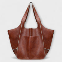 Sac de voyage surdimensionné en cuir marron, anses longues et fermeture à rabat