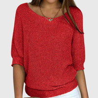 Pull ample en maille douce rouge, col rond, manches trois-quarts bouffantes, bords côtelés