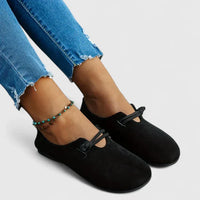 Mocassins orthopédiques noirs à bride élastique, vue de côté, bout arrondi.