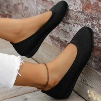 Chaussures confortables en tricot noir, vue de côté, bout rond et semelle flexible