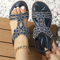 Sandales noires à décor floral en strass bleu, bride ajustable et talon ouvert