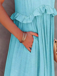 Robe bleu turquoise sans manches, détail volants à la taille