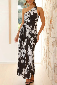 Robe longue plissée asymétrique sans manches, motifs noir et blanc, décolleté une épaule