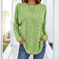Pull tunique en maille coton vert, coupe ample, encolure ronde, manches longues
