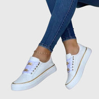 Chaussures orthopédiques blanches à lacets, liseré doré et détail métallisé sur la tige